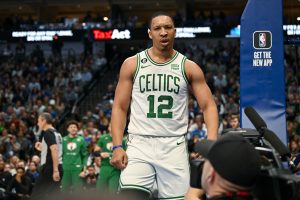 Jan 5, 2023; Dallas, Texas, USA; Boston Celtics forward Grant Williams (12) reacts to being fouled by the Dallas Mavericks after making a basket during the second quarter at the American Airlines Center. Mandatory Credit: Jerome Miron-USA TODAY Sports