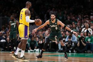 Jan 28, 2023; Boston, Massachusetts, USA; Boston Celtics forward Jayson Tatum (0) defends Los Angeles Lakers forward LeBron James (6) during the first half at TD Garden. Mandatory Credit: Paul Rutherford-USA TODAY Sports