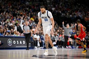 Apr 7, 2023; Dallas, Texas, USA; Dallas Mavericks center JaVale McGee (00) celebrates after making a three point shot against the Chicago Bulls during the first half at the American Airlines Center. Mandatory Credit: Jerome Miron-USA TODAY Sports