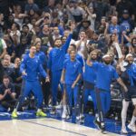 The Dallas Mavericks fans and team bench celebrate during the game between the Dallas Mavericks and the Boston Celtics in game four of the 2024 NBA Finals at American Airlines Center.