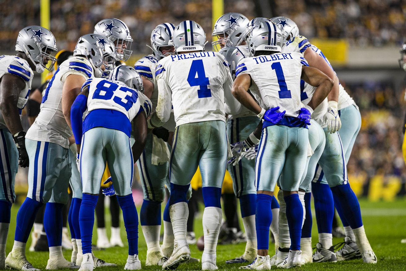 Dallas Cowboys quarterback Dak Prescott (4) calls a play in the huddle during the regular season NFL football game between the Dallas Cowboys and Pittsburgh Steelers on October 06, 2024 at Acrisure Stadium in Pittsburgh, PA.