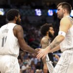 Dallas Mavericks guard Luka Doncic (77) celebrates with Dallas Mavericks guard Kyrie Irving (11)